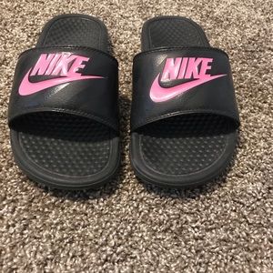 Nike slides with pink logo